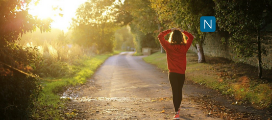 Image of a woman walking, symbolizing the benefits of neurofeedback therapy, such as increased emotional regulation, improved cognitive function, and reduced symptoms of anxiety and depression.