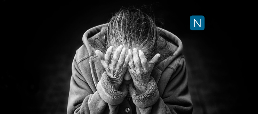 "Image of an elderly person crying, with the focus on their hands. This powerful image highlights the emotional impact of dementia and the potential therapeutic effects of light stimulation on the condition.