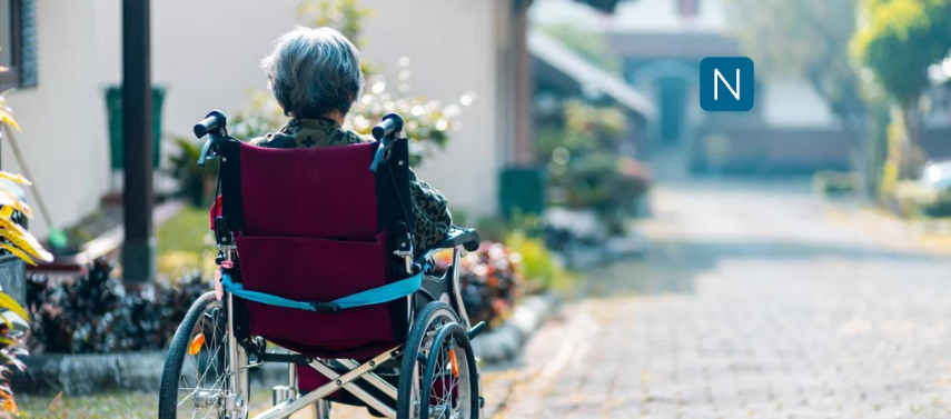 Elderly woman on a wheelchair, representing hope regarding photobiomodulation for Alzheimer's.